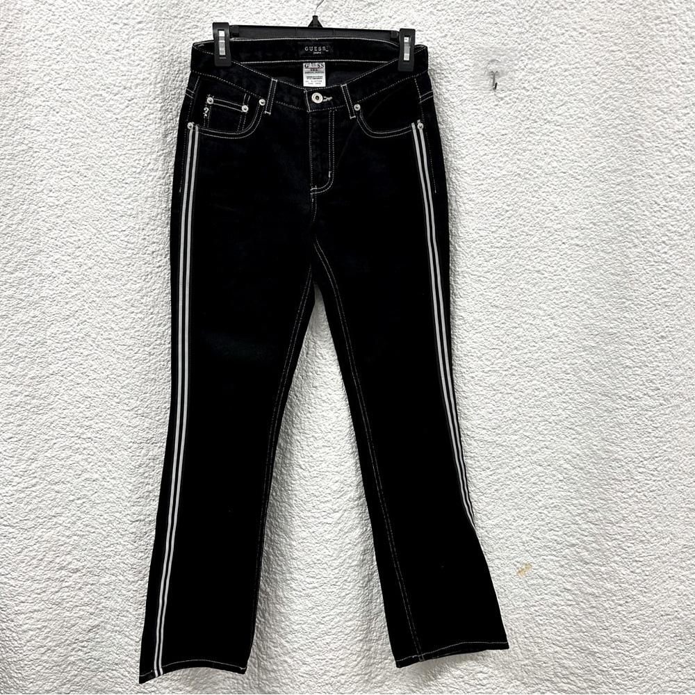 Guess women’s 26 black denim with white stripes on the side of each leg
